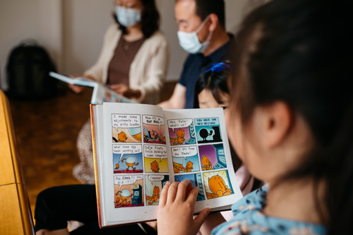 Detail of a girl reading a comic book