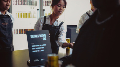 Bar staff serving drinks at the November 2023 Nocturnal.