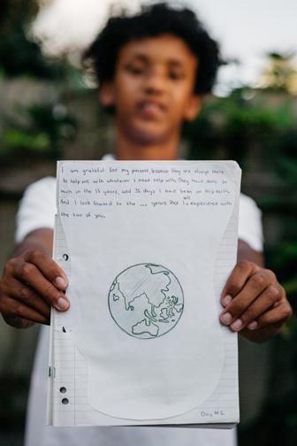 Boy holding a journal