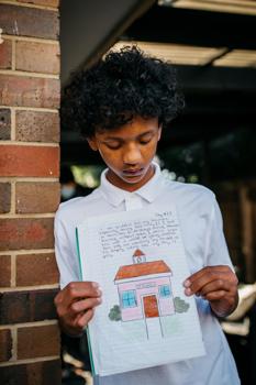 Boy holding a journal