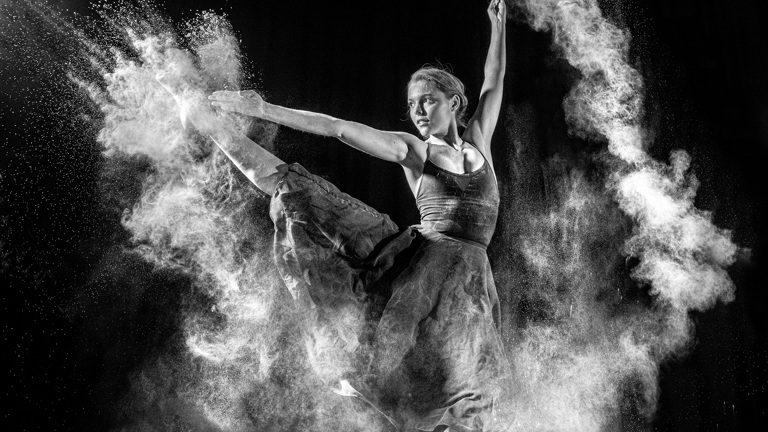 A dancer strikes an athletic pose