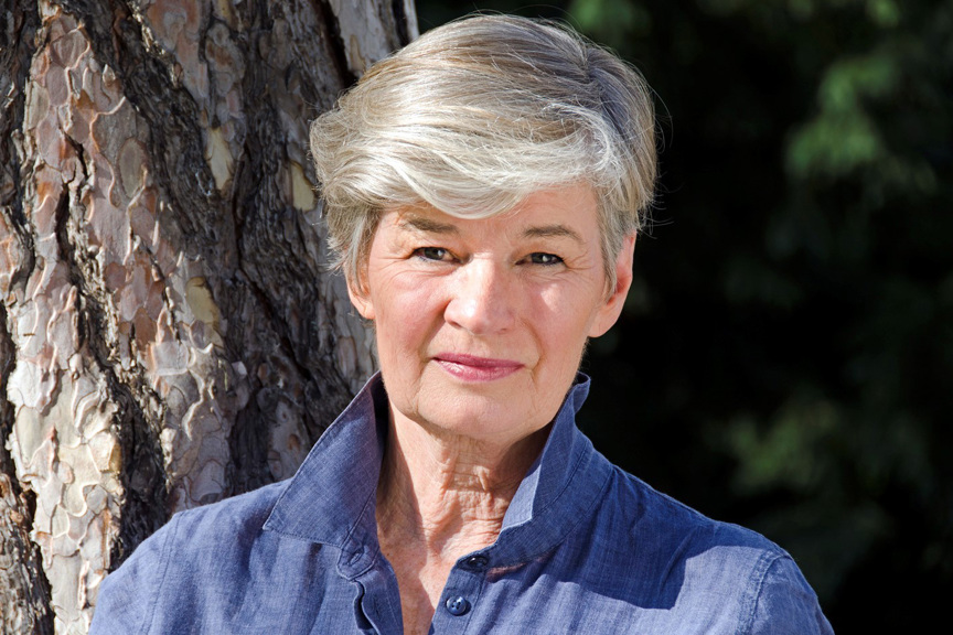 a woman with silver hair looking straight at the camera