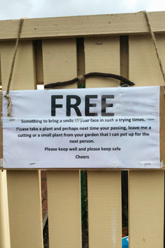 Print sign hanging on a gate