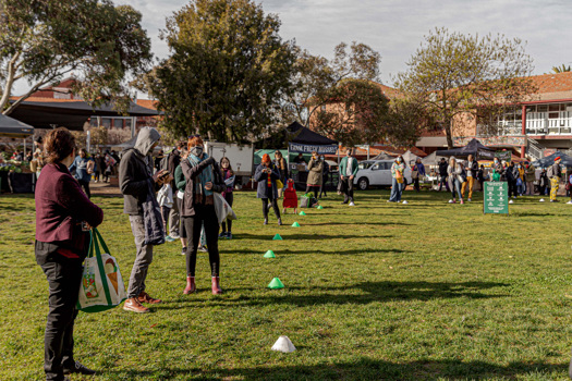 People lining up at a farmers market