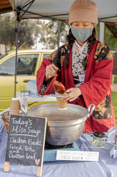 Woman serving miso soup