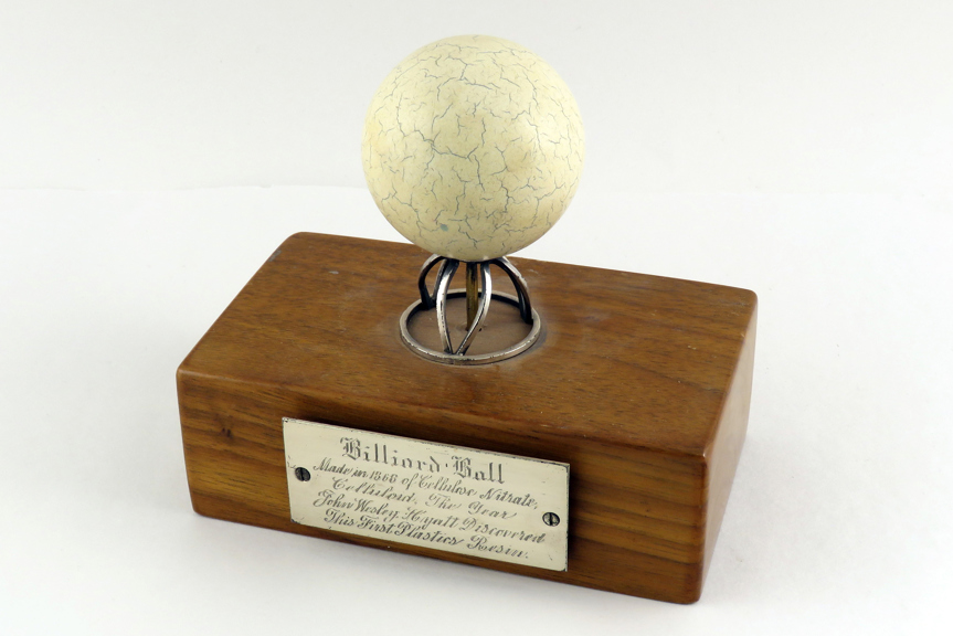 a cracked white ball on a display