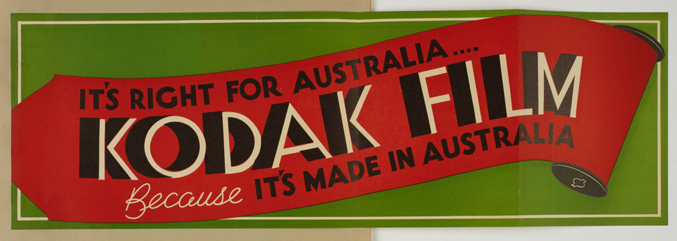 Poster with a green background and red illustration of a roll of film with the text "It's right for Australia..Kodak Film because it's made in Australia"