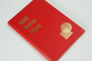 Red hardcover book with gold print on the front cover and down the spine