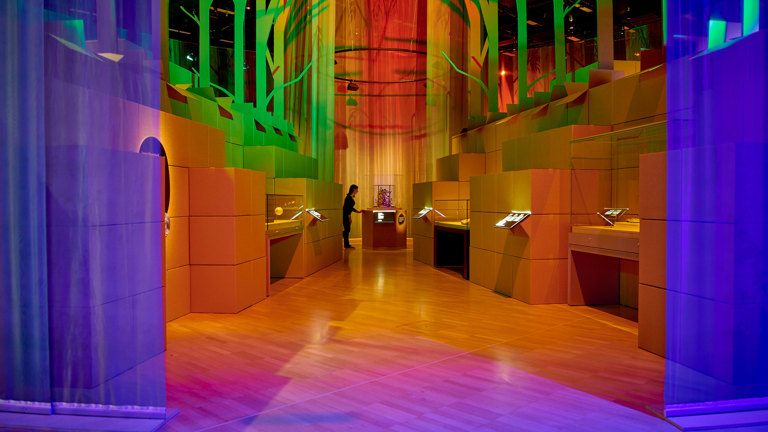 Interior of the exhibition with green and purple lighting