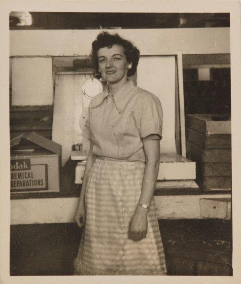 Balck and white photograph of a woman looking directly at the camera