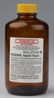 Brown glass bottle with a yellow cap. It has printed white label with a poison warning 