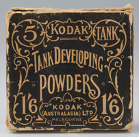 Cardboard box with worn corners. The label is printed in black with the decorative illustration and text shown as the negative