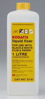 White tall square plastic bottle  with a yellow cap and label