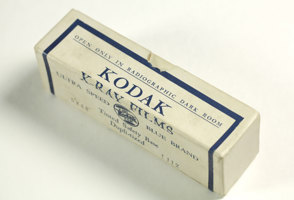 Empty white cardboard box; opened; printed in blue and white colour scheme.