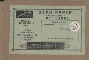 Rectangular brown paper envelope and green printed label.