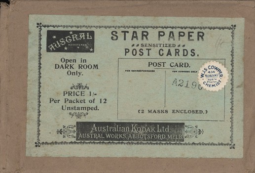 Rectangular brown paper envelope and green printed label.