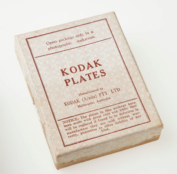 Box with a white lid with a red printed label