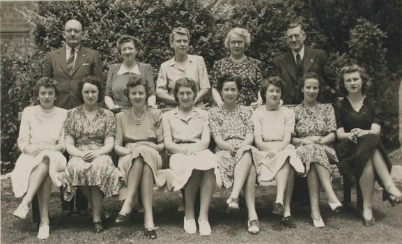 Group portrait of two men and  12 womem