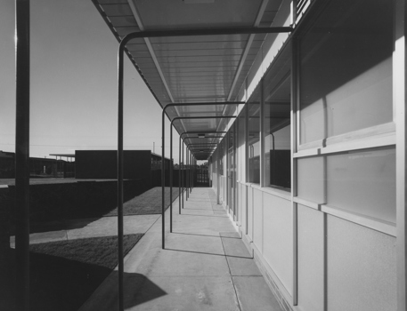 Black and white image of a building looking from the side