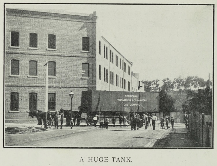 Large iron water tank on horse drawn carriage