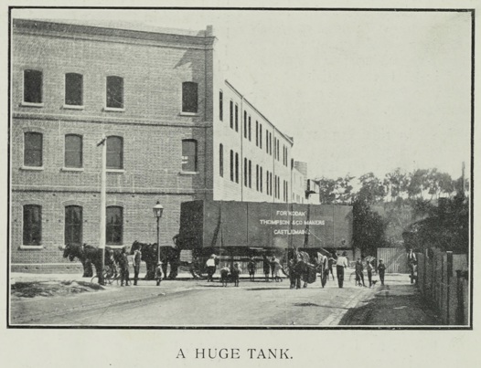 Large iron water tank on horse drawn carriage