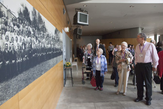 Former Kodak employees viewing historic staff panorama portrait at the 10th Anniversary of the Kodak Collection mini-exhibition at Melbourne Museum