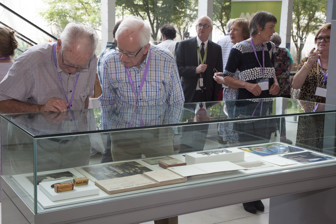 Former Kodak employees viewing display cases at the 10th Anniversary of the Kodak Collection mini-exhibition at Melbourne Museum