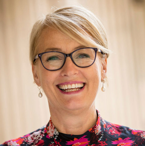 Woman with blonde hair wearing glasses