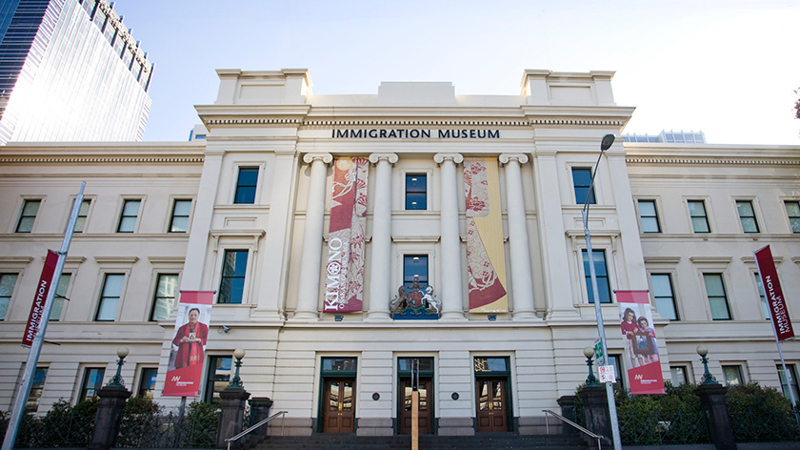 External view of Immigration Museum from Flinders Street in early evening.