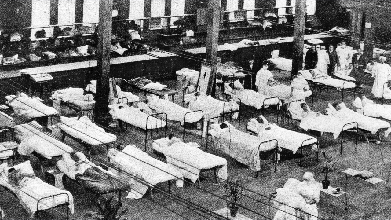 Hospital beds line the Exhibition Building's great hall during the influenza pandemic in 1919.