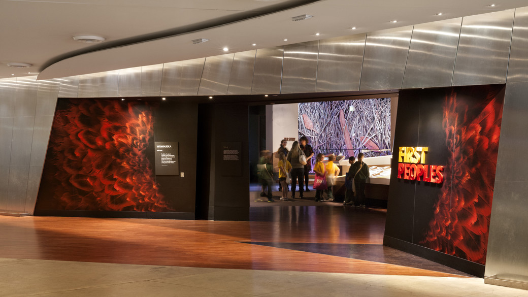 Group of school children in the entrance of a museum gallery