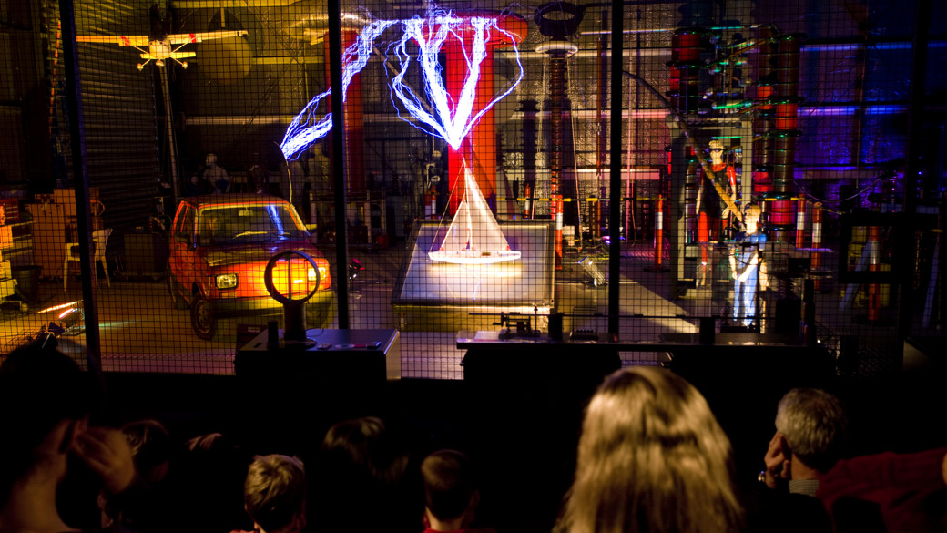 Audience watching a science show about electricity