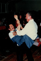 Two men smiling and dancing