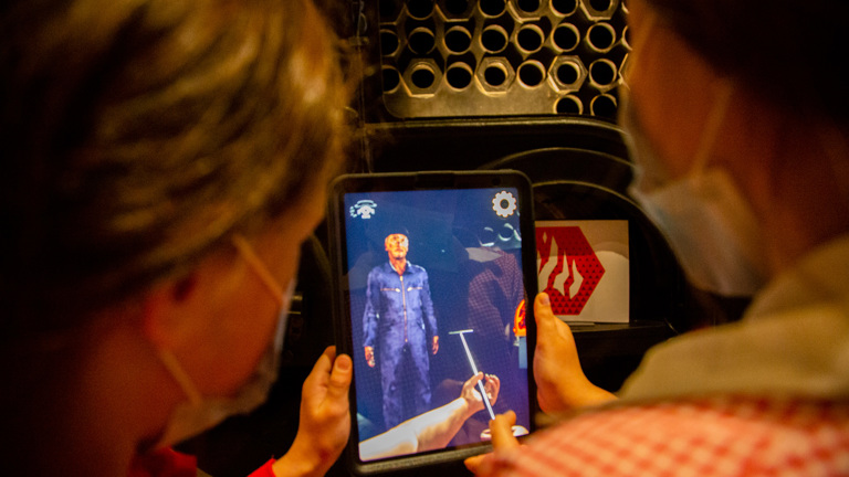 View of to people from behind holding a ipad