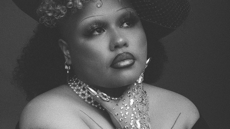 Black and white image of Kaiit posing for portrait