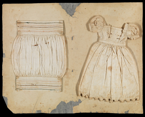 Detail of inside pages of unbound book of folded paper leaves containing a range of sewing and knitting samples