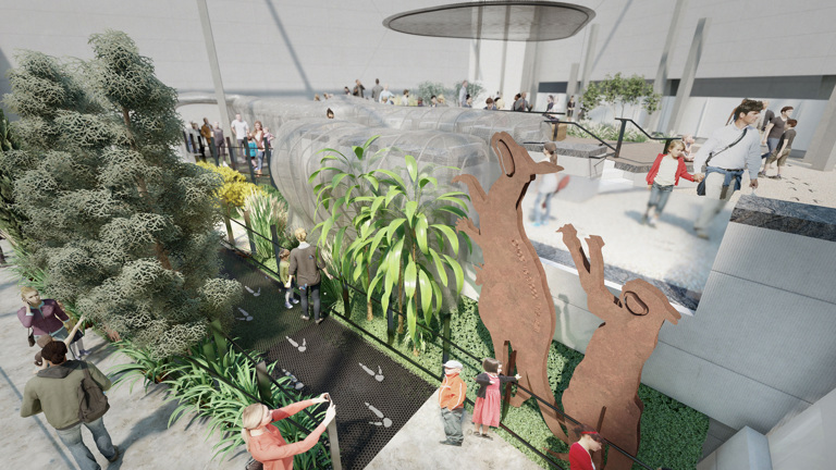 Model of a two-level exhibition space with visitors wandering about. There are lots of trees and two large animal sculptures.