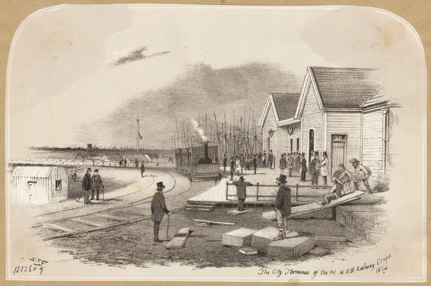The city terminus of the Melbourne and Hobson's Bay Railway Company pictured in 1854. A Hobson's Bay locomotive can be seen in the background.