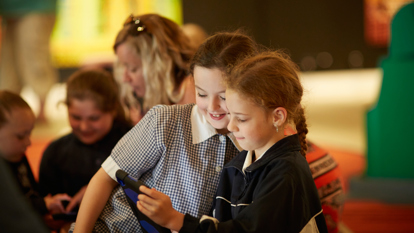rimary school students using iPads during the 'Place and Culture' program in the First Peoples exhibition, Bunjilaka, Melbourne Museum. 