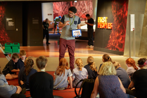 Pablo presenting an education program to primary school students in Bunjilaka, Melbourne Museum. 