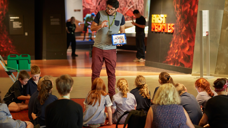 Pablo presenting an education program to primary school students in Bunjilaka, Melbourne Museum. 
