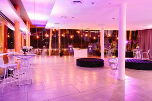 Function set up with tall tables and couches