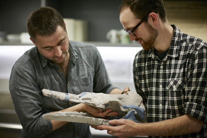 Erich Fitzgerald and Tim Zieglar with 3D model of Alfred's skull.