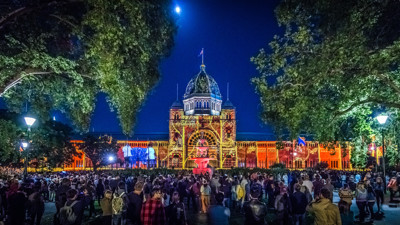 Crowds watching projections on the southern side of the Royal Exhibition Building during White Night (Blak Nite) at Carlton Gardens, 2016. 
