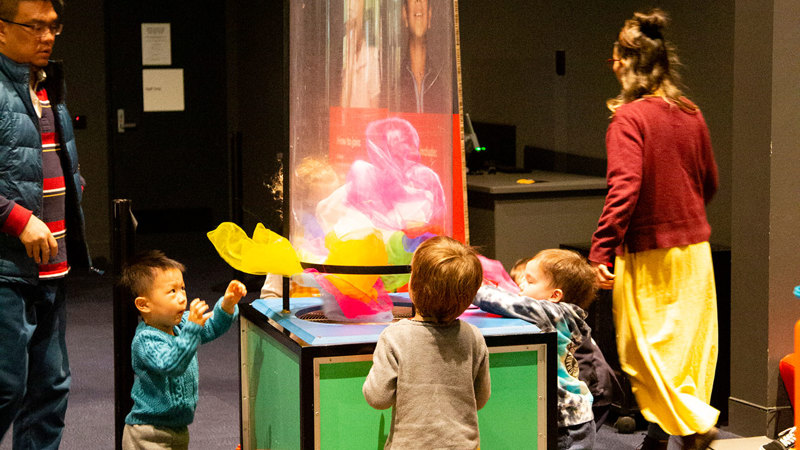 Families enjoying the Hobson's Bay Library Story Time in the Beyond Perception exhibition, during Little Kids Day In - Caring for Country program.