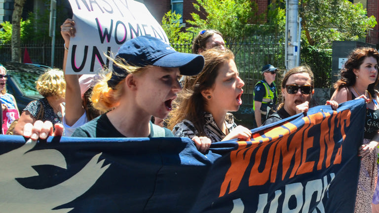 Group of women holding a protest banner