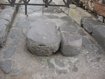 Two large stones in the middle of a street
