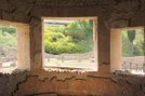 Interior shot of three windows in a room within the Suburban baths. Through the windows we can see the outside.
