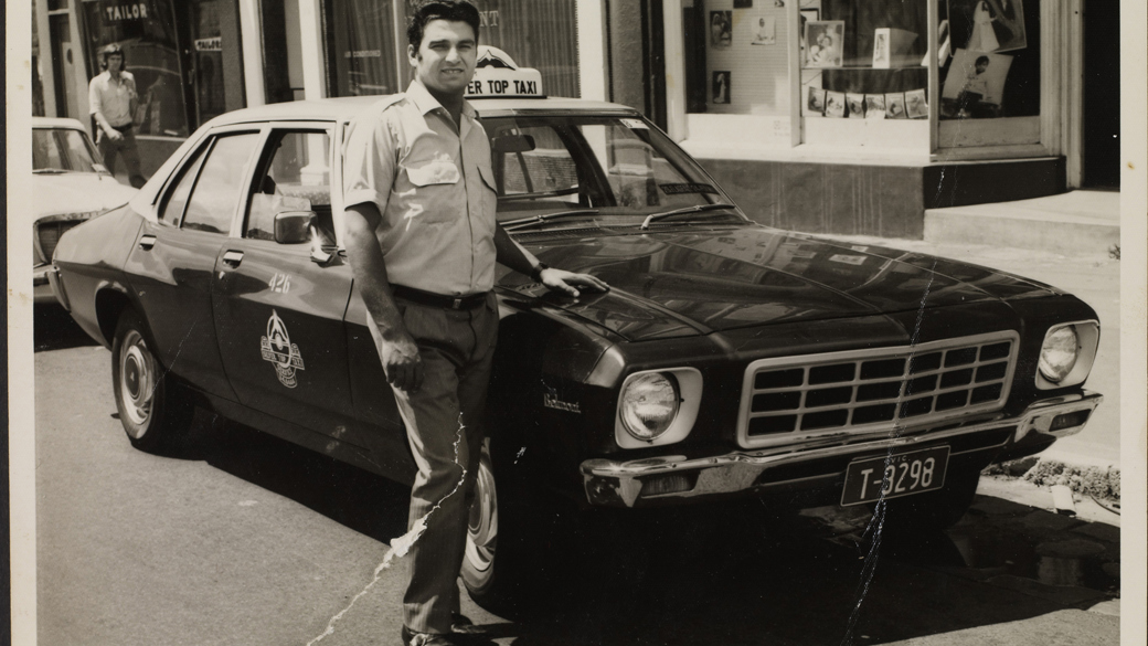 Portrait of taxi driver in front of the first taxi he drove, ca. 1972.