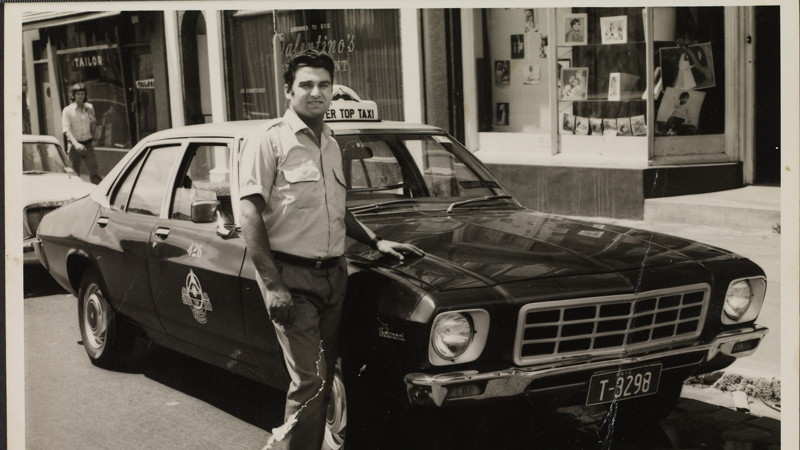 Portrait of taxi driver in front of the first taxi he drove, ca. 1972.